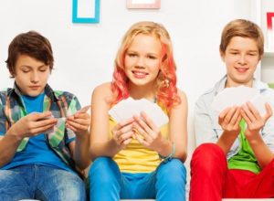 teenagers playing cards