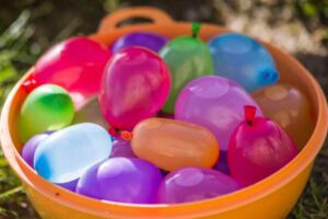 Bowl filled with water-filled balloons