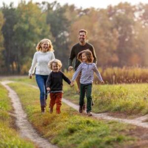 Family walking on track during scavenger hunt